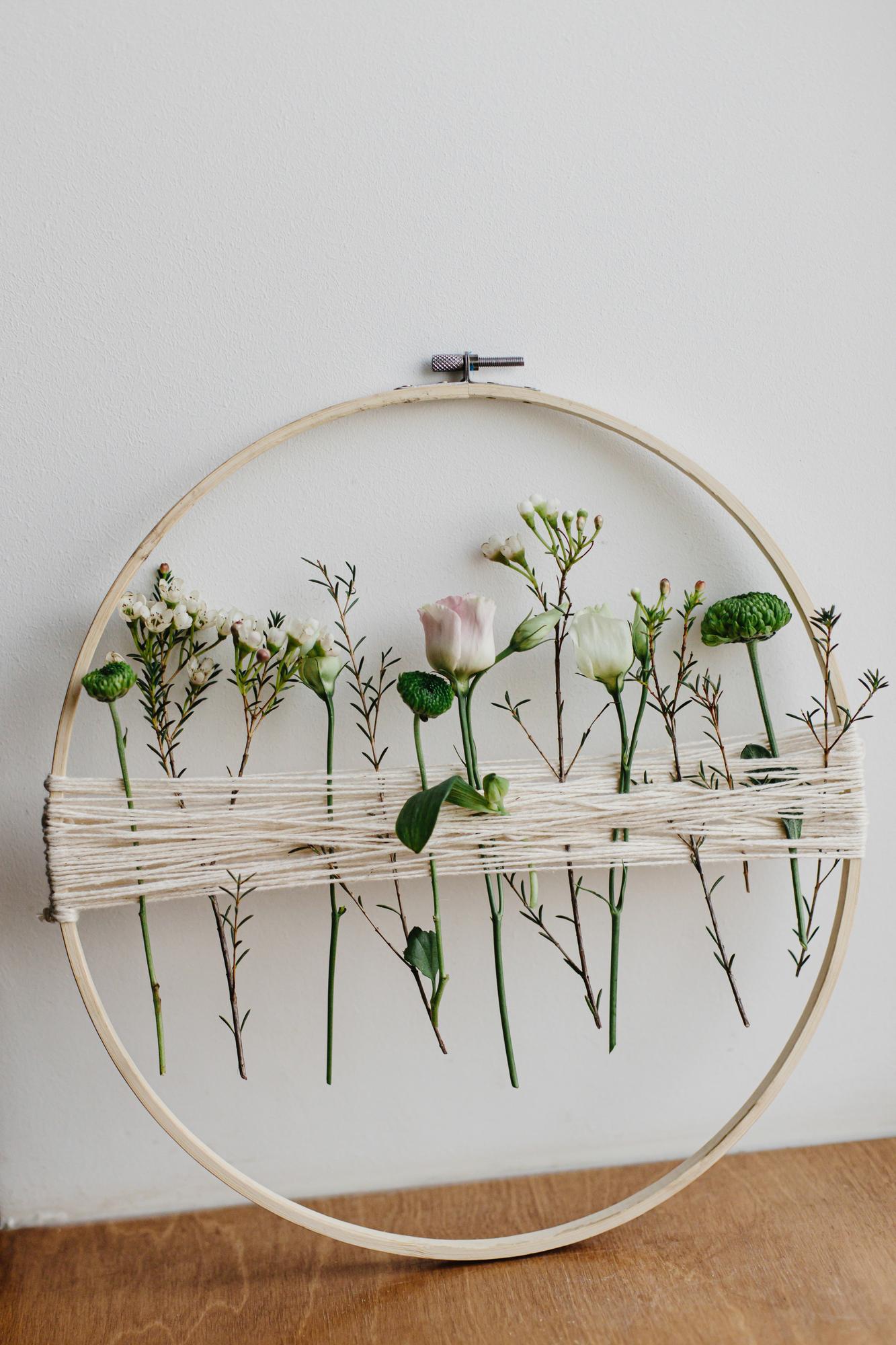 Studio workspace with embroidery hoop and light
