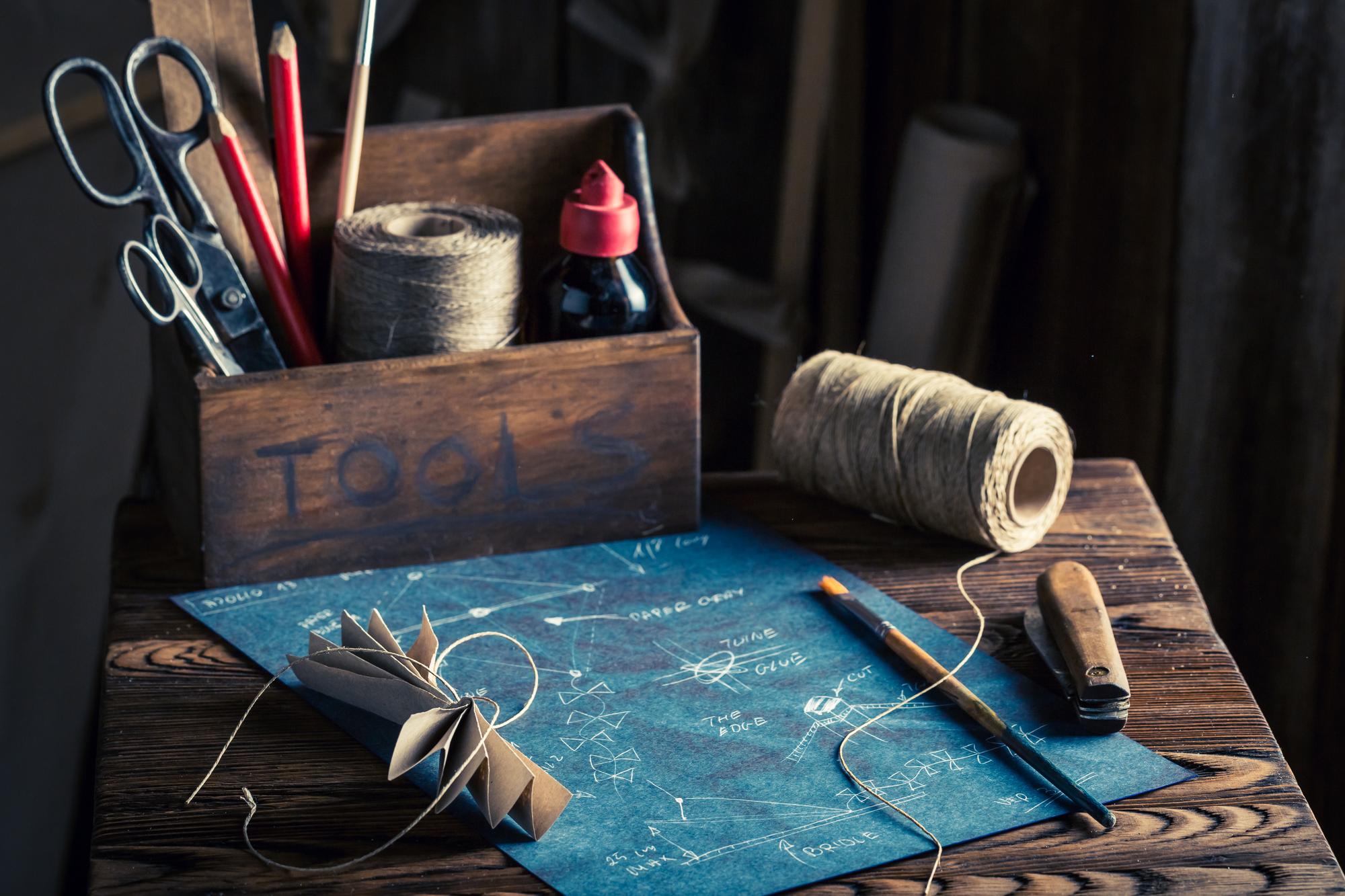 Workshop table with curated threads and tools